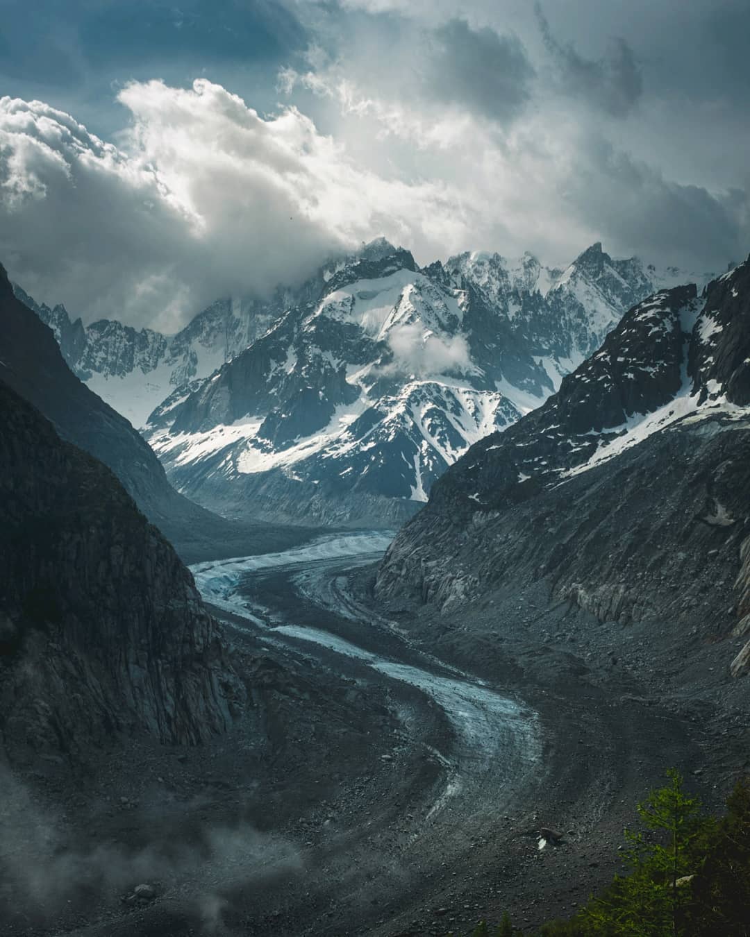 A glacier winding through a mountain valley
