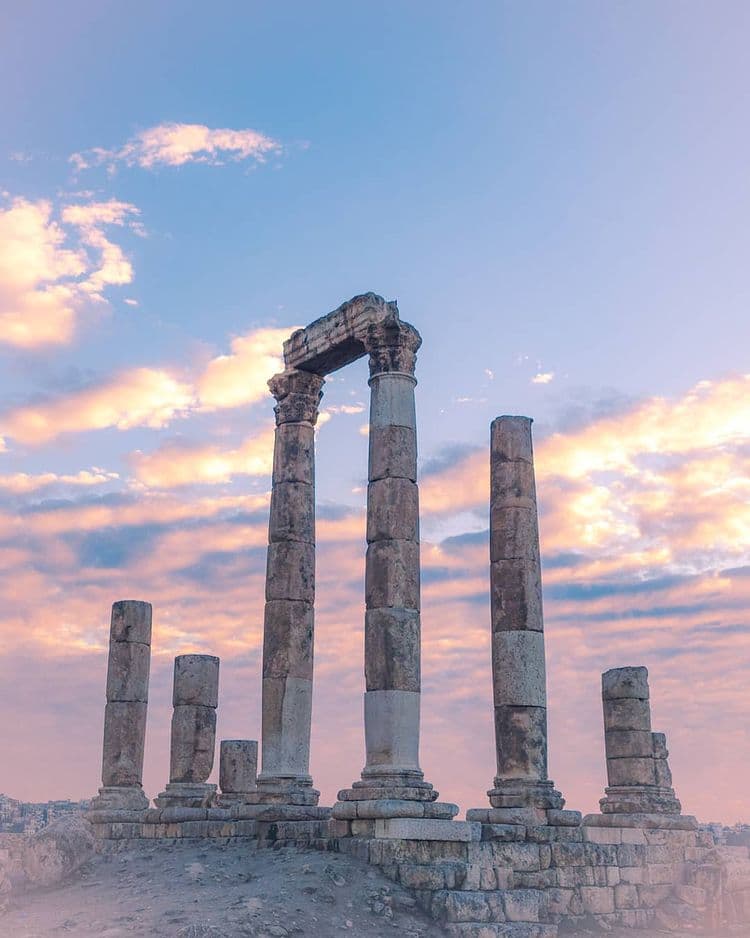 Ancient stone columns at sunset