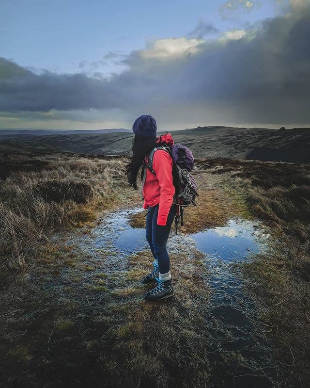 Hiking a moorland trail in a red jacket