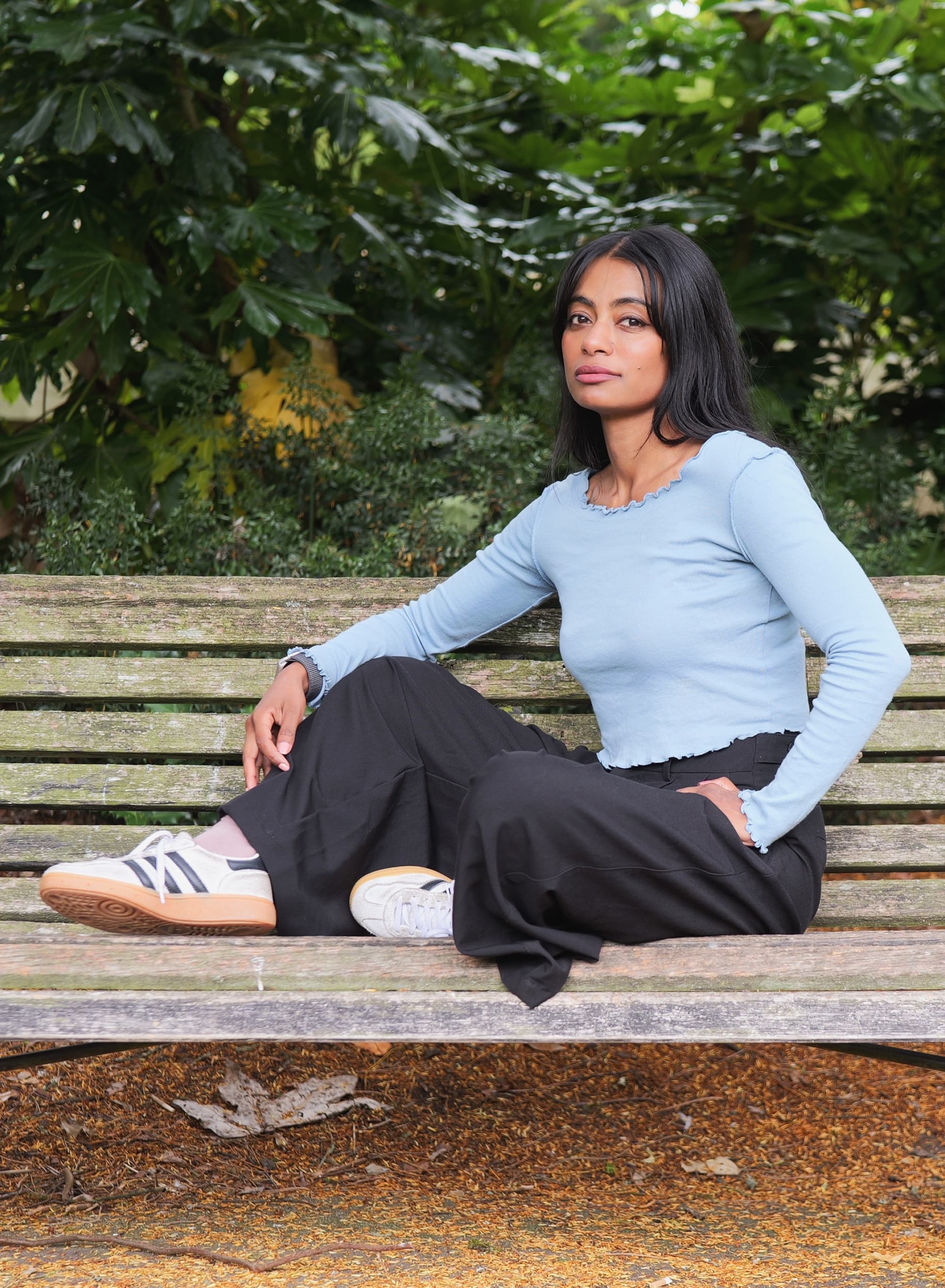 Shabia sitting on a park bench