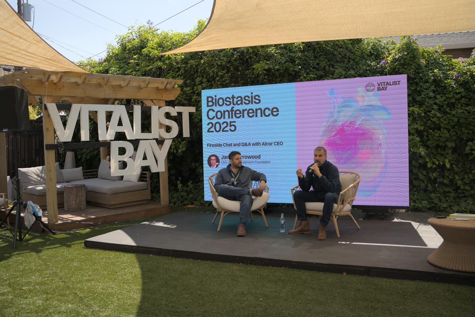 Biostasis Conference stage screen, on-site photo